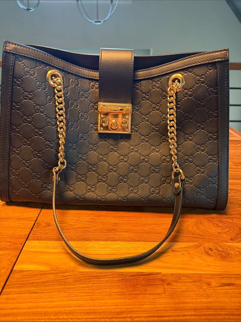 Gucci Black Embossed Leather Shoulder Bag with Gold Chain Straps. - Authentic